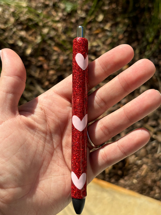 Red glitter pen with pink hearts